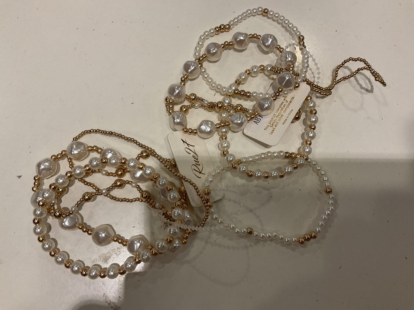 Pearl and gold set of three bracelets