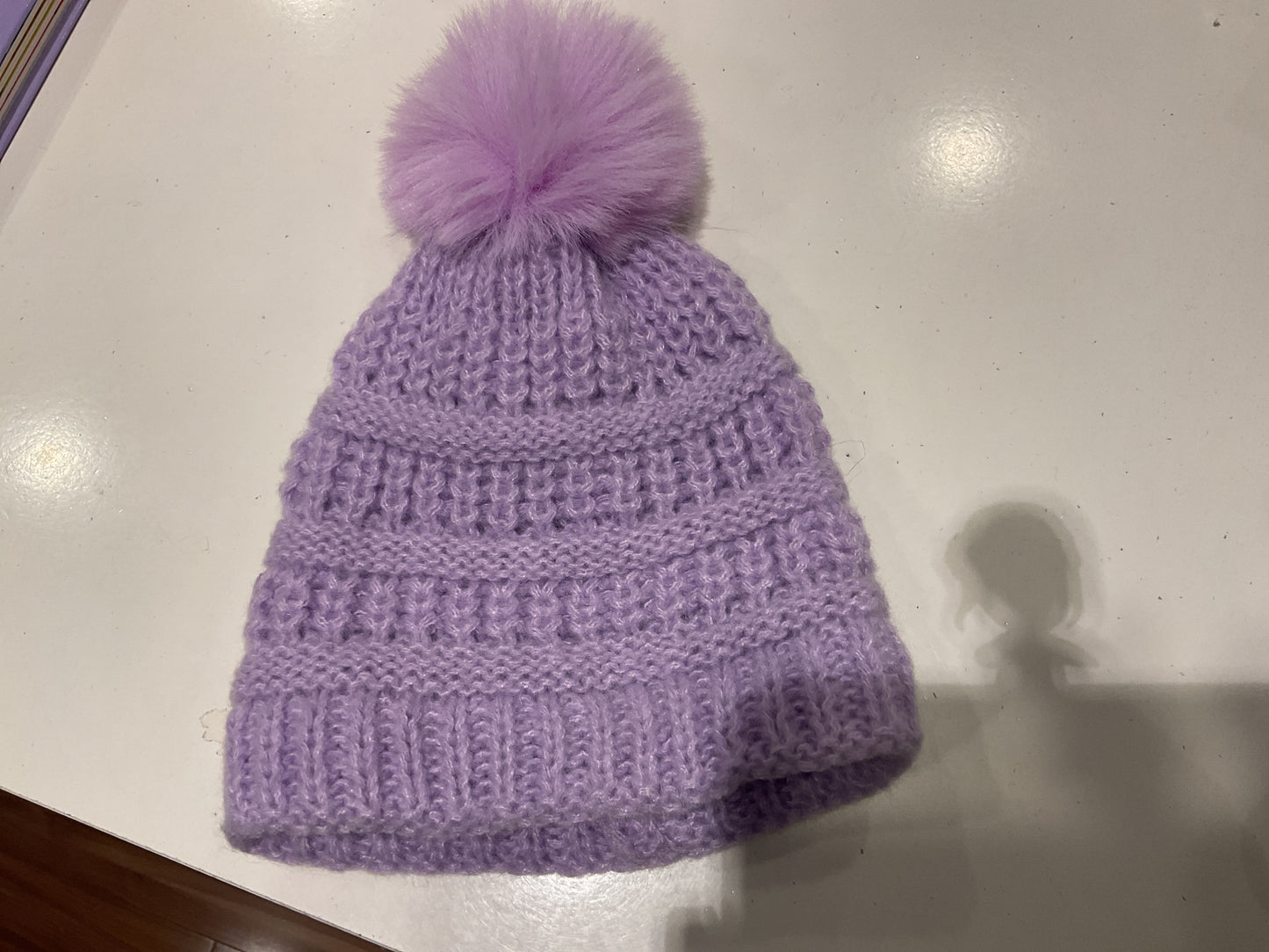 Purple pom pom hat